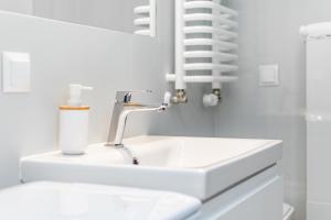 Kúpeľňa v ubytovaní Kasprzaka 29 B-C by Homeprime