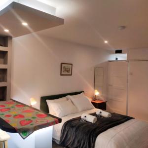 Postel nebo postele na pokoji v ubytování Imaculada Home Royal - Centro de Braga, Historico