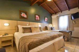 Кровать или кровати в номере Pousada Belluno