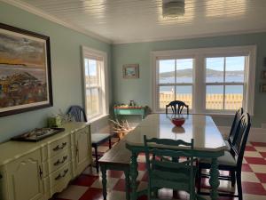a dining room with a table and chairs at Saffron House in Twillingate