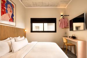Postel nebo postele na pokoji v ubytování Savanna - by Loginn Tel-Avivian hotels