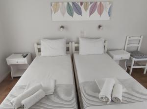 Postel nebo postele na pokoji v ubytování Vetti Rooms