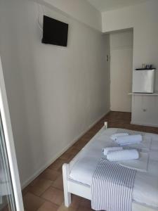 Postel nebo postele na pokoji v ubytování Vetti Rooms