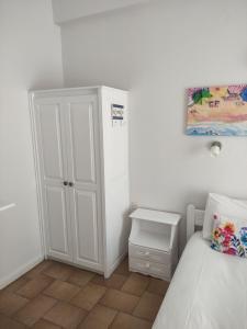 Postel nebo postele na pokoji v ubytování Vetti Rooms
