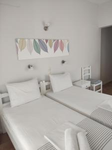 Postel nebo postele na pokoji v ubytování Vetti Rooms