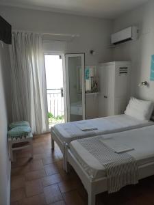 Postel nebo postele na pokoji v ubytování Vetti Rooms