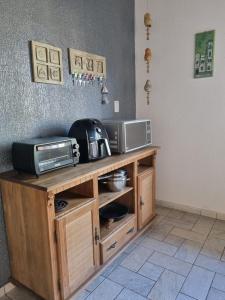 Kuchyň nebo kuchyňský kout v ubytování Canto das Ondas Apart Studios