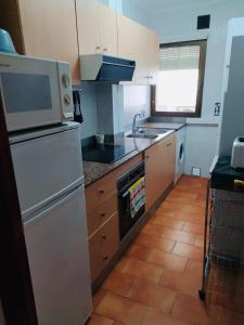 Kuchyň nebo kuchyňský kout v ubytování Apartamento Casalmar