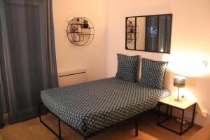 Ένα ή περισσότερα κρεβάτια σε δωμάτιο στο Le panoramique - Parking, Tram A, Netflix