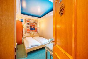 Postel nebo postele na pokoji v ubytování Hotel Plankl