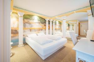 Postel nebo postele na pokoji v ubytování Hotel Plankl