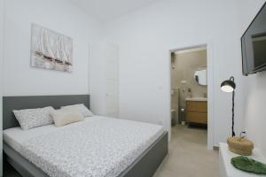 Ένα ή περισσότερα κρεβάτια σε δωμάτιο στο Apartmani Vrlika