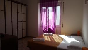 Postel nebo postele na pokoji v ubytování DaNicolas via dei Partigiani apartment