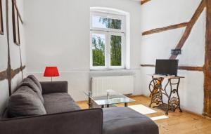a living room with a couch and a table at Ferienwohnung Stefanie in Rambin