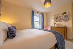 Voodi või voodid majutusasutuse Kingsley Cottage toas