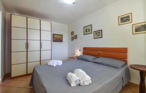 a bedroom with two towels on a bed at Secca in Costa Rei +13 photos