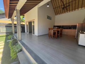 an open kitchen and dining area of a house at Anugerah Villa 3 in Amed