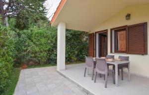 a table and chairs sitting on a patio at Secca 3 in Costa Rei