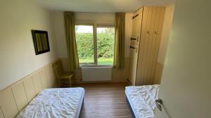 Postel nebo postele na pokoji v ubytování VZ890 Vakantiehuis in Renesse