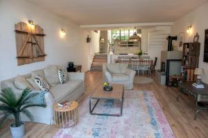 a living room with a couch and a table at Casa Panorama in Tihany