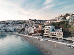 a view of a beach with buildings and the water at Pipo apartmentS in Ulcinj