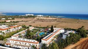 an aerial view of a resort near the ocean at Loutsiana Deluxe Apts in Ayia Napa