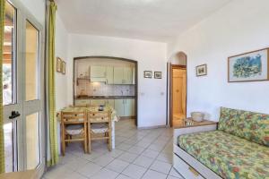 a living room with a couch and a table at Casa Ilva - Colle Paradiso Experience in Capoliveri