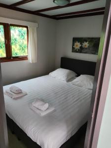 Llit o llits en una habitació de Vakantiehuisje Veluwe bij Speuldersbos