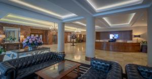 a lobby with couches and a waiting room at Salthill Hotel in Galway