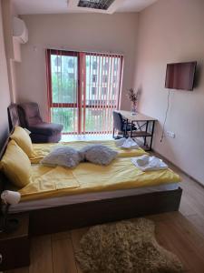 En eller flere senge i et værelse på Veliko Tarnovo central apartament