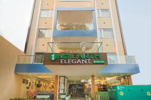 an apartment building with a sign that reads live earth element at One Earth Elegant in Rishīkesh