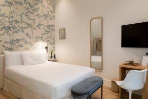 Hotel Tayko Sevilla客房内的一张或多张床位