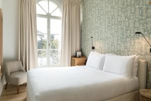 Hotel Tayko Sevilla客房内的一张或多张床位