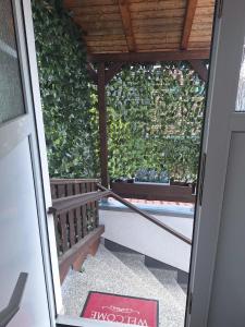 a door leading to a porch with a bench at Ferienwohnung Heinel in Bad Sulza