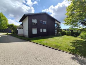 a house with a driveway at Blackforest Perla in Höchenschwand