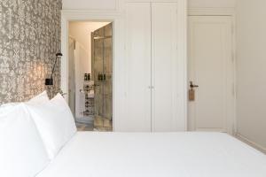 Hotel Tayko Sevilla客房内的一张或多张床位