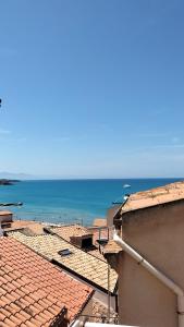 a view of the ocean from the roof of a building at Casa Rosellina in Cefalù +11 photos
