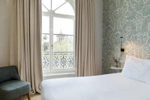 Hotel Tayko Sevilla客房内的一张或多张床位