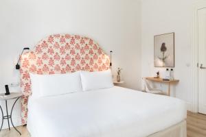 Hotel Tayko Sevilla客房内的一张或多张床位