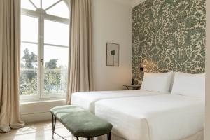Hotel Tayko Sevilla客房内的一张或多张床位
