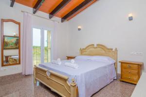 Ein Bett oder Betten in einem Zimmer der Unterkunft Sa Montanyeta