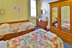 Cama ou camas em um quarto em Astor Private Hotel