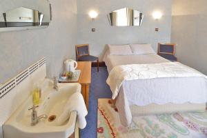 Cama ou camas em um quarto em Astor Private Hotel
