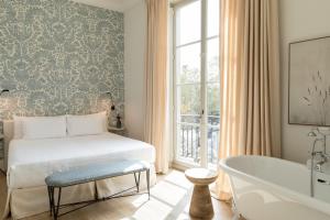 Hotel Tayko Sevilla客房内的一张或多张床位