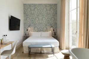 Hotel Tayko Sevilla客房内的一张或多张床位