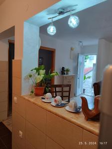 a kitchen with a counter with two dishes on it at 3-Bedroom NewHome in Mostar +14 photos
