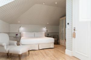 Hotel Tayko Sevilla客房内的一张或多张床位