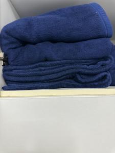 a pile of blue towels sitting on a shelf at Sunnyside Suite Afytos in Afitos +27 photos