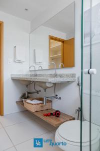 a bathroom with a sink and a mirror at Ponta de Inhambupe Residences in Baixio