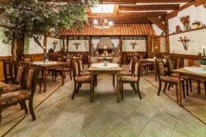 a dining room with wooden tables and chairs at Landhotel Zur Linde in Verden